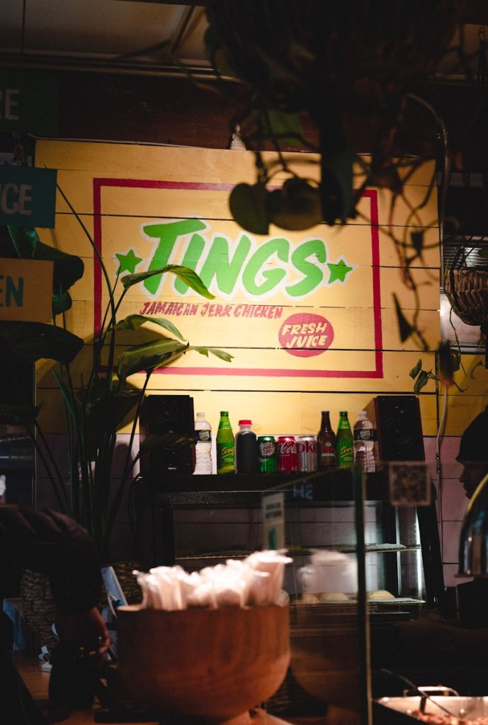 a restaurant with a large neon sign on the wall
